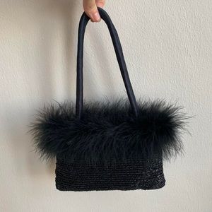 Black bag with beading and feather details